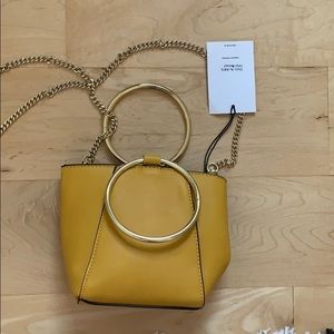 Hand held hand bag or clutch cross body bag